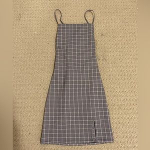Garage mini dress with a tie back and slit in a size xs. Pleated pattern